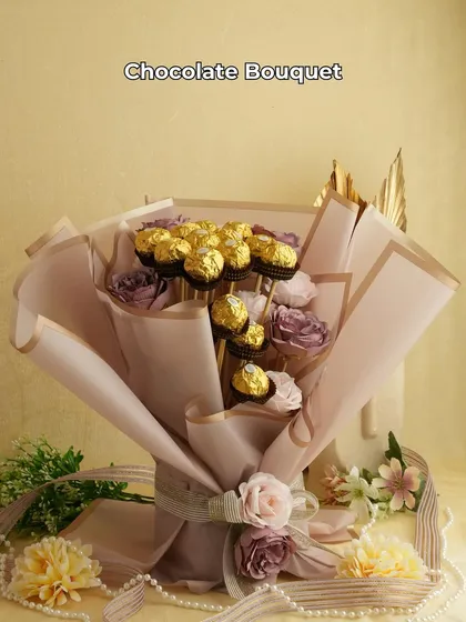 For the one who prefers chocolates over flowers. This elegant bouquet is made of Ferrero Rocher chocolates and artificial roses, beautifully wrapped for a lasting impression. It's a sweet and sophisticated gift.