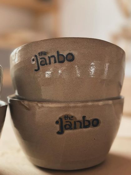 Two of our custom-stamped bowls, stacked and ready. These are the workhorses of our studio.
