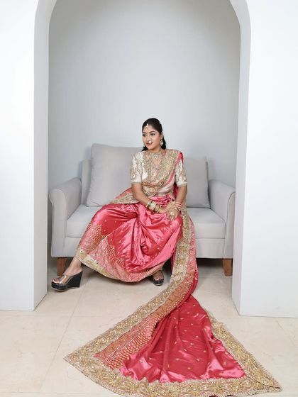The pink brocade Nauvari looks stunning in this minimalist studio setting.