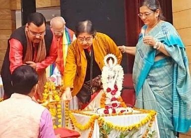 Participating in the lamp lighting ceremony to inaugurate the Sangeet Milon competition.