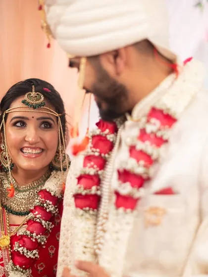 The bride's radiant smile as she looks at her groom during the ceremony.