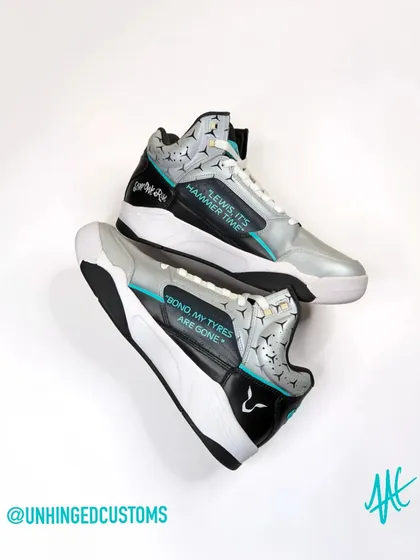 The inner side of the Lewis Hamilton Jordans, featuring his logo and famous radio messages like "Bono, my tyres are gone."