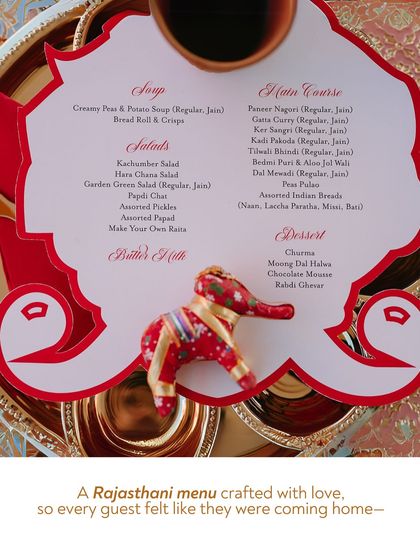 A beautifully designed Rajasthani menu, complete with a small fabric elephant. This thoughtful detail made every guest feel like they were being welcomed home with a lovingly crafted meal.