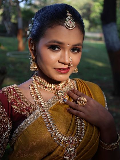This shot highlights the authentic temple jewellery set, which is essential for completing the traditional South Indian bridal look.