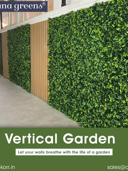 A simple yet effective vertical garden installation. Alternating panels of green foliage and wood-style cladding create a modern, clean look for this long corridor wall.