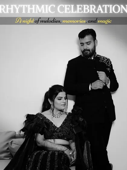 A timeless black and white portrait from the Sangeet. This image has a classic, elegant feel, focusing on the couple's stylish outfits and their quiet, confident connection.