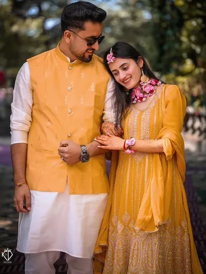 A tender moment between the couple during their yellow-themed Haldi ceremony at Woodville Palace, Shimla.