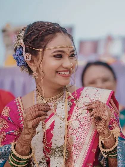 The mangalsutra moment is one of the most significant in a Maharashtrian wedding. We ensure our bride's makeup and hair are perfect for these close-up, emotional shots.