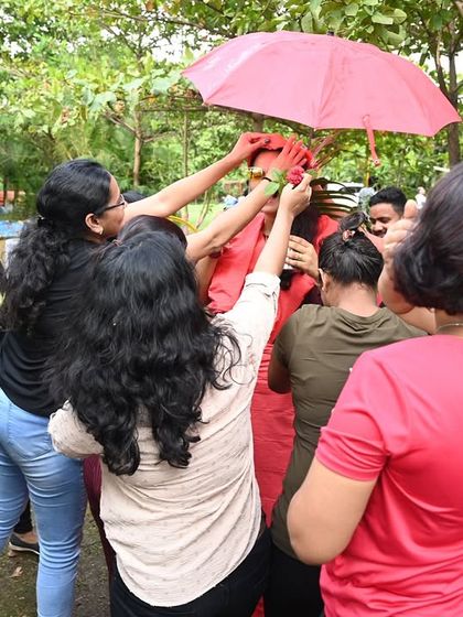 A team works together to complete a creative challenge during an outdoor event. These activities require communication and coordination, strengthening the bonds between team members.
