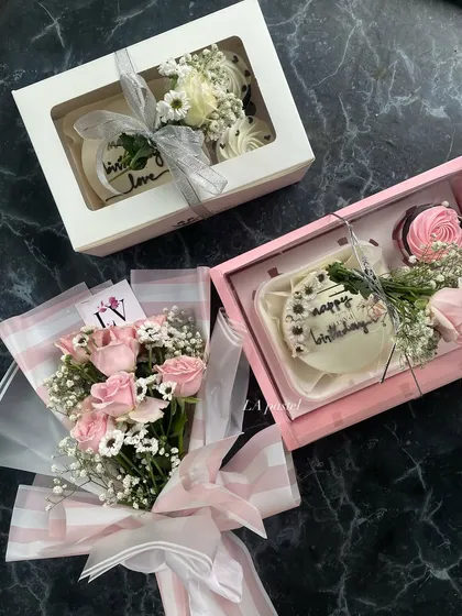 More than just cake, I create full gift experiences. This hamper includes a mini cake and cupcakes, beautifully packaged with a fresh flower bouquet to make someone's day.