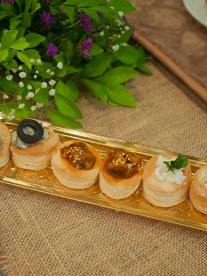 A variety platter of my vol-au-vents, or puff pastry cups. This selection shows different fillings, including creamy mushroom, a savory mince, and a fresh salsa.