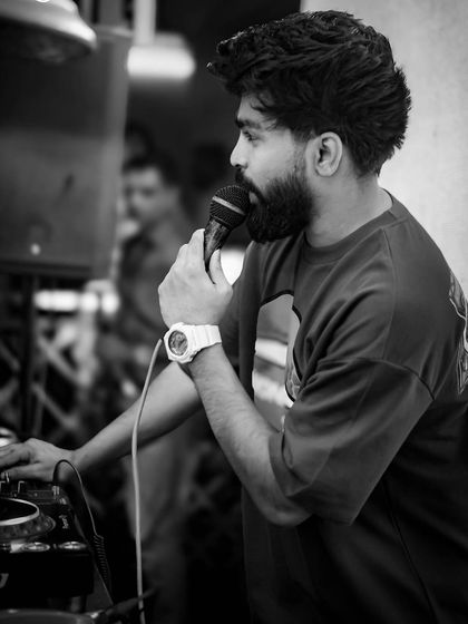 A black and white shot of me on the mic. I believe a DJ should be a performer, interacting with the crowd and being a visible part of the party's energy.