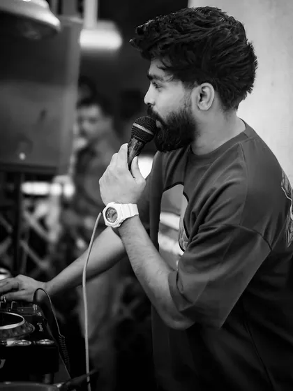 A black and white shot of me on the mic. I believe a DJ should be a performer, interacting with the crowd and being a visible part of the party's energy.