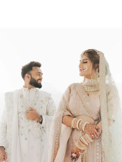 A candid and loving portrait of the couple, their easy smiles and comfortable embrace telling a story of deep connection.