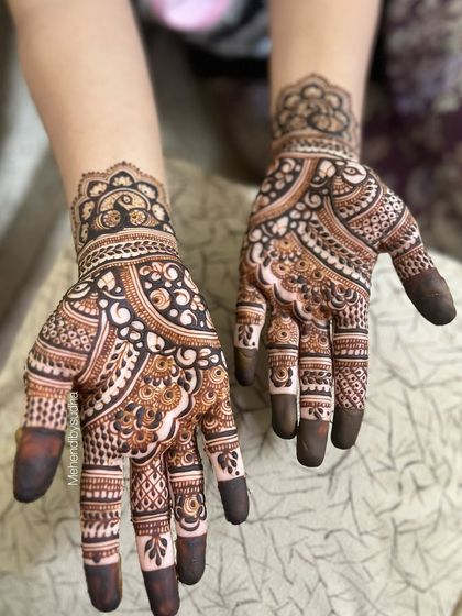 An intricate and beautiful mehendi design for a 'grah pravesh' or housewarming ceremony. The dense patterns are auspicious and celebratory for a new beginning.