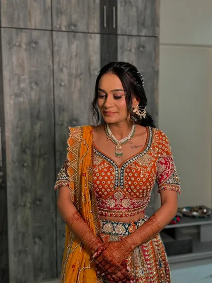 A soft, romantic look for her engagement. We focused on a flawless base and defined eyes to complement her intricately embroidered lehenga.