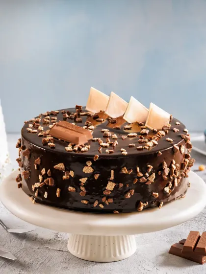 A rich chocolate KitKat cake with a glossy ganache and crunchy toppings, shot for Bakingo's e-commerce platform.