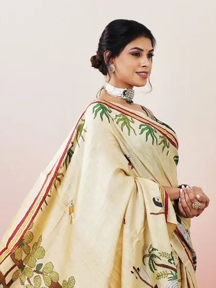 A smiling portrait of the model wearing this beautiful and unique printed saree.