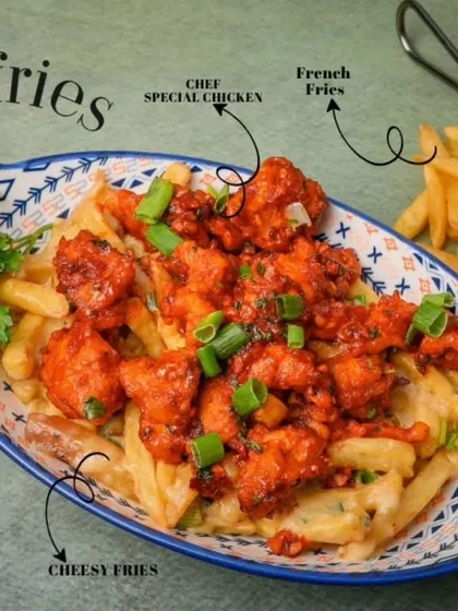 A truly indulgent comfort dish, our Chicken Cheese Fries feature a generous portion of crispy french fries topped with a creamy cheese sauce and bite-sized pieces of our Chef's Special tangy chicken, garnished with fresh spring onions.
