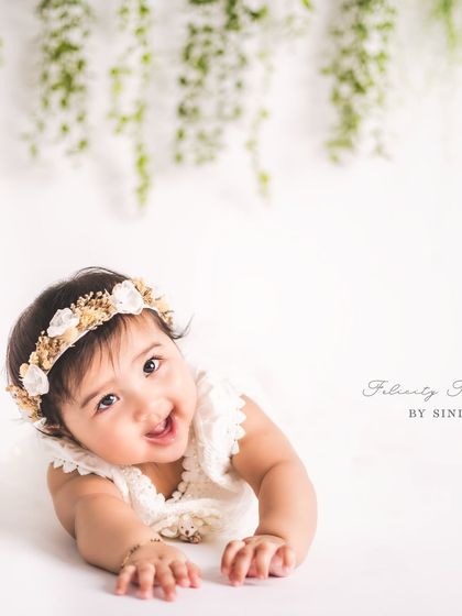 A beautiful, expressive portrait from a sitter session. The simple background and soft lighting draw all the attention to her sweet face and curious eyes.