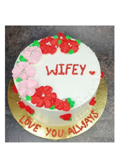 A sweet floral cake for a "Wifey". This chocolate strawberry cake is decorated with red and pink flowers for a romantic birthday surprise.