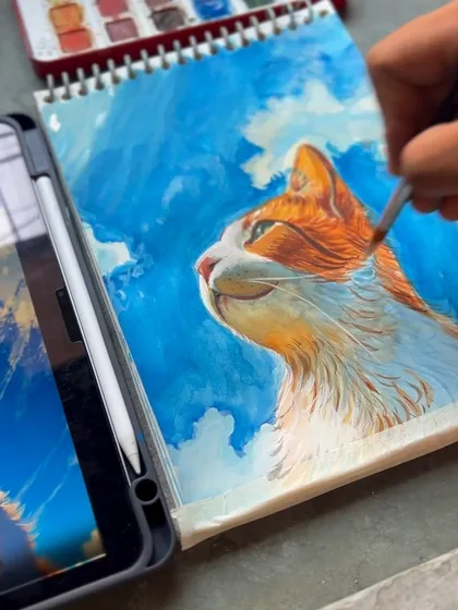 Adding more details to the cat's fur and the clouds in the background. Watercolor allows for beautiful, soft layers.