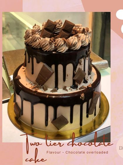 A decadent two-tier chocolate overloaded drip cake. This is a perfect choice for any celebration that calls for rich, indulgent chocolate.