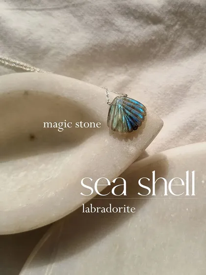 My labradorite sea shell pendant, which I call a magic stone. The beautiful flashes of color in the labradorite make this a truly unique and powerful piece.