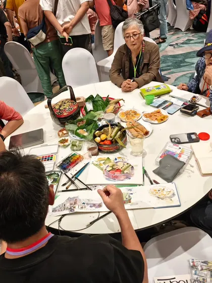 A behind the scenes look at our food sketching session at the Asia-link sketch fest. Our table was filled with delicious food, art supplies, and creativity.