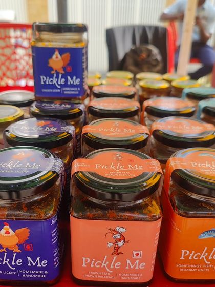 A colourful display of our top non-veg pickles. You can see our Chicken Lickin' pickle, Prawn Balchao, and the Something's Fishy Bombay Duck pickle, all ready to spice up your meals.