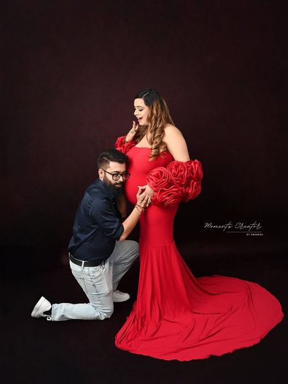 A playful and loving moment as the dad-to-be listens to the baby bump. This pose is a favorite for capturing the excitement and connection between expecting parents.