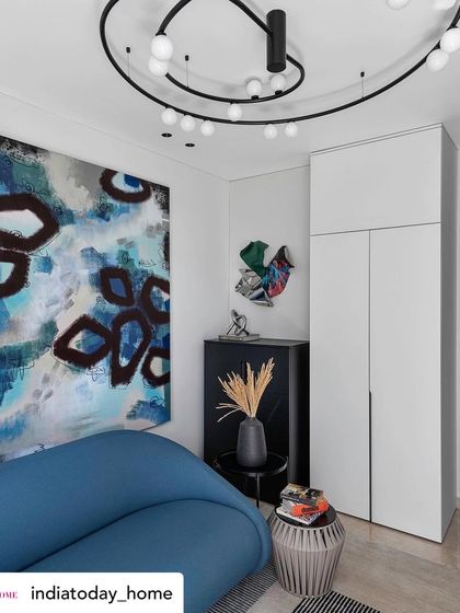 Another angle of the family room, showcasing how different art pieces and bold furniture can coexist. The space is designed to feel dynamic and inspiring, reflecting the homeowner's creative spirit.