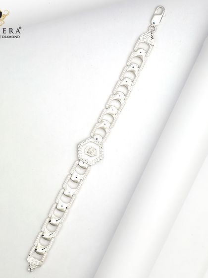 This men's silver bracelet features bold, geometric links with a central hexagonal charm. It's a stylish piece for the man who wants his wrist to have a little sparkle.