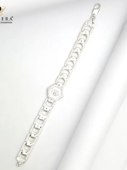 This men's silver bracelet features bold, geometric links with a central hexagonal charm. It's a stylish piece for the man who wants his wrist to have a little sparkle.