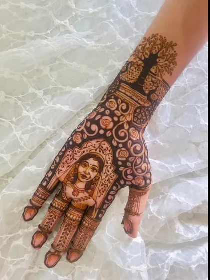 The bride's hand from the same set, featuring her portrait. On her wrist, I drew a Tree of Life, symbolizing growth and family, making this design deeply personal.