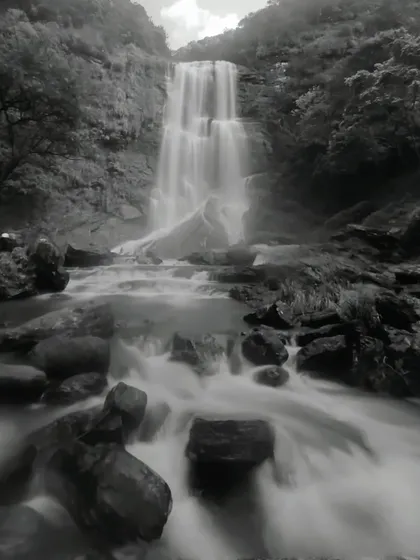 A black and white long-exposure photo of Hebbe falls, giving it a timeless and artistic feel.