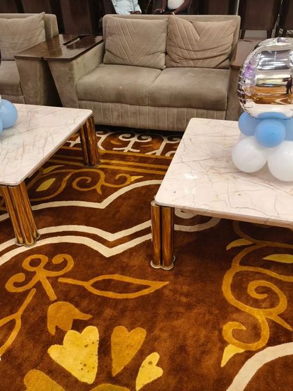 Simple balloon bunches in blue and silver used as table centerpieces for a Hot Air Balloon-themed party.