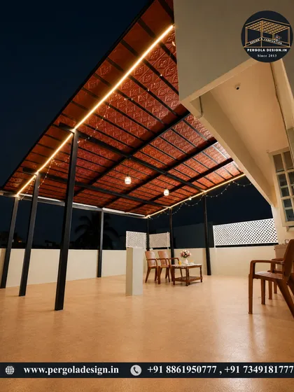 The angled view of this rooftop pergola showcases its large coverage area. The sturdy black steel frame provides a modern contrast to the traditional red Mangalore tiles.