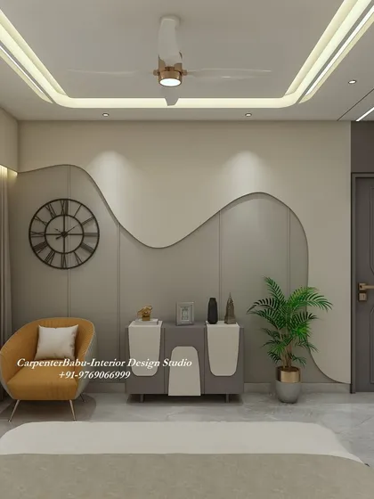 This bedroom wall features a beautiful, flowing design that adds a soft, organic touch to the room. The simple console and armchair complete the serene look.