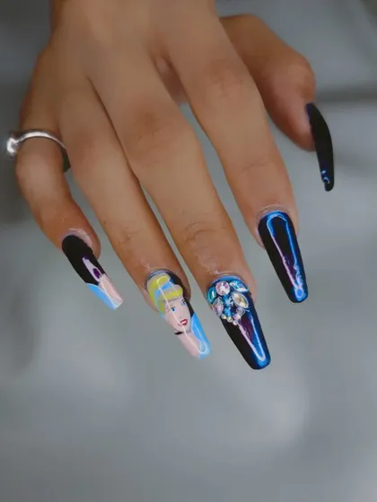 A magical Cinderella-themed set with a hand-painted portrait, chrome nails, and a stunning crystal accent nail.