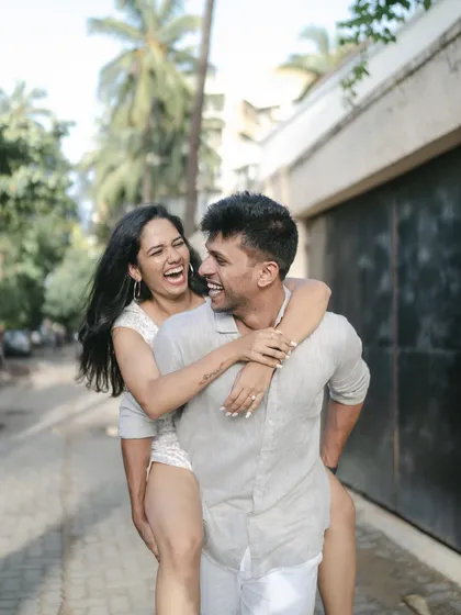 A pre-wedding shoot should be filled with your genuine energy. We captured this spontaneous, joyful piggyback ride to reflect the couple's playful and carefree connection.