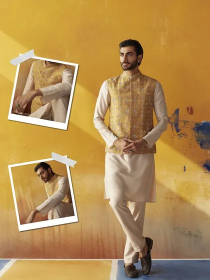 Festive celebrations call for a touch of brightness. This kurta and bundi set, with its clean lines and subtle texture, is a perfect choice for the groom's squad, blending tradition with modern sensibilities.
