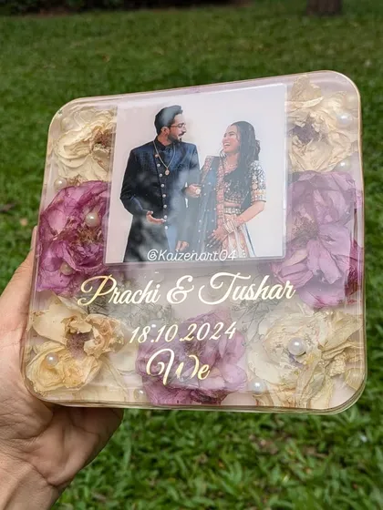This square resin block is a perfect example of a wedding keepsake. It features the couple's photo, names, and date, surrounded by their beautifully preserved wedding flowers.