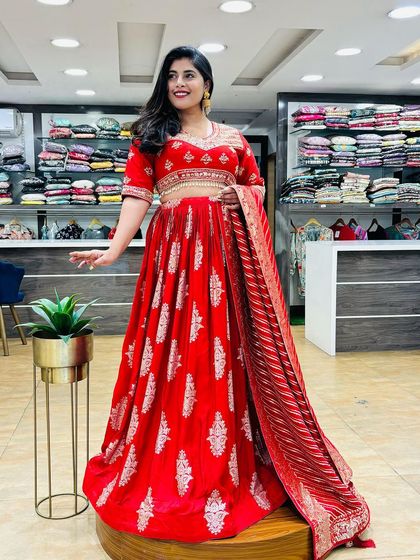 Day 6 of Navratri celebrated with this beautiful red Anarkali-style lehenga. The silver work on the red velvet fabric gives it a very royal and festive look.