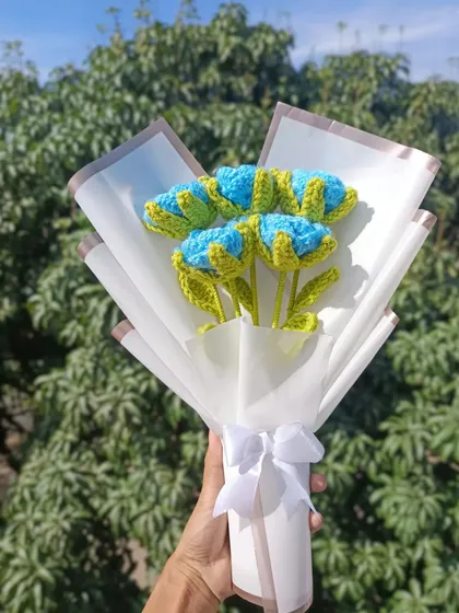 A simple and sweet bouquet of blue and green tulips.