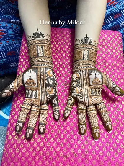 A beautiful design with temple bells (jhumkas) and lotus flowers, creating a very delicate and feminine look.