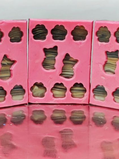 My "Tabby Kitties" entry for a peekaboo soap challenge, featuring soap dough cats and pawprints on a woodgrain soap base.