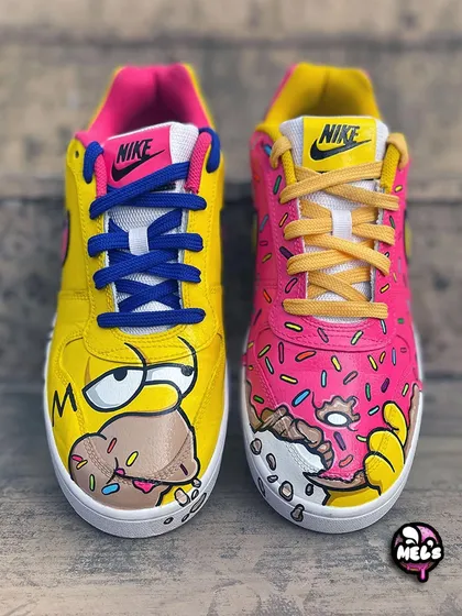 D'oh! We brought the world of The Simpsons to life on these Nikes. One shoe features Homer drooling over a donut, while the other is a giant pink-frosted donut with sprinkles. These cartoon-inspired sneakers are all about fun and nostalgia.