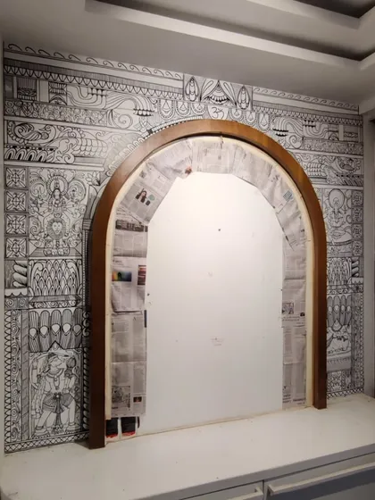 Creating this intricate archway for a puja room was a truly special project. I use detailed line art and traditional Indian motifs to design sacred spaces that feel both personal and peaceful.