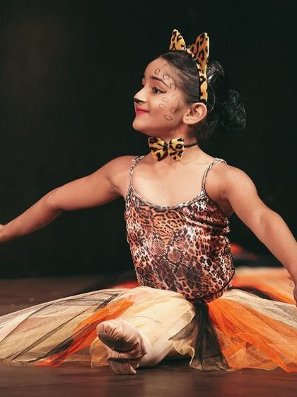 A solo moment for one of our talented young dancers as a leopard. We provide opportunities for students to shine individually within our group performances.